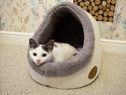 Soft, curved, hemispherical plush-lined cat bed, with a white and gray kitten.